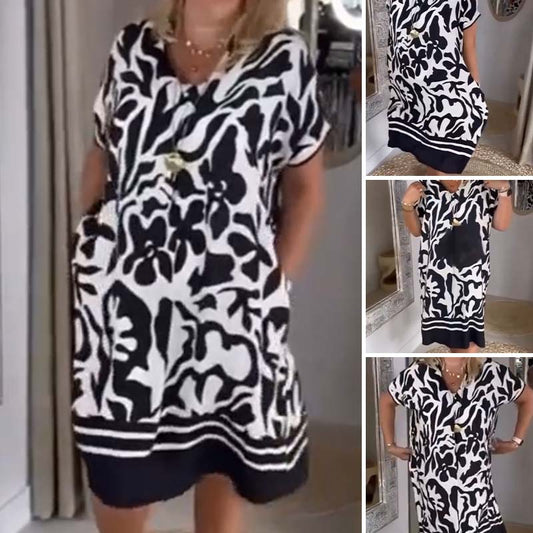 Elegant kjole med V-hals, vintageprint og lommer