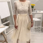Elegant midi-kjole med blonderhals og mesh