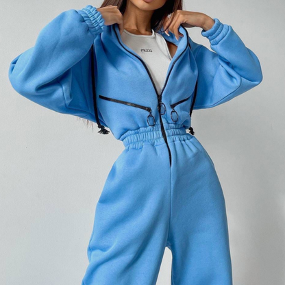 Komfortabel ensfarget jumpsuit med hette for kvinner