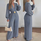 Elegant jumpsuit med V-hals, vide ben og belte