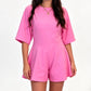 Uformell jumpsuit med rund hals og innsvingt midje
