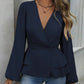 Peplum-bluse med V-hals og lanterneermer for damer