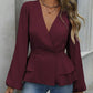 Peplum-bluse med V-hals og lanterneermer for damer