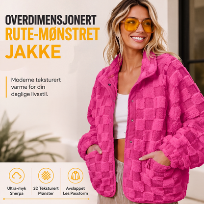 Damelue jakke med sjakkbrettmønster og trykknapper