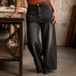 Dameskjørt i lag over denimjeans