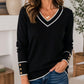 Elegant strikket topp for kvinner med kontrast-V-hals