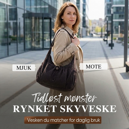 Rutet trekkveske i skyform med snøring og rynker