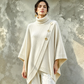 Asymmetrisk turtleneck poncho-strikkegenser for kvinner